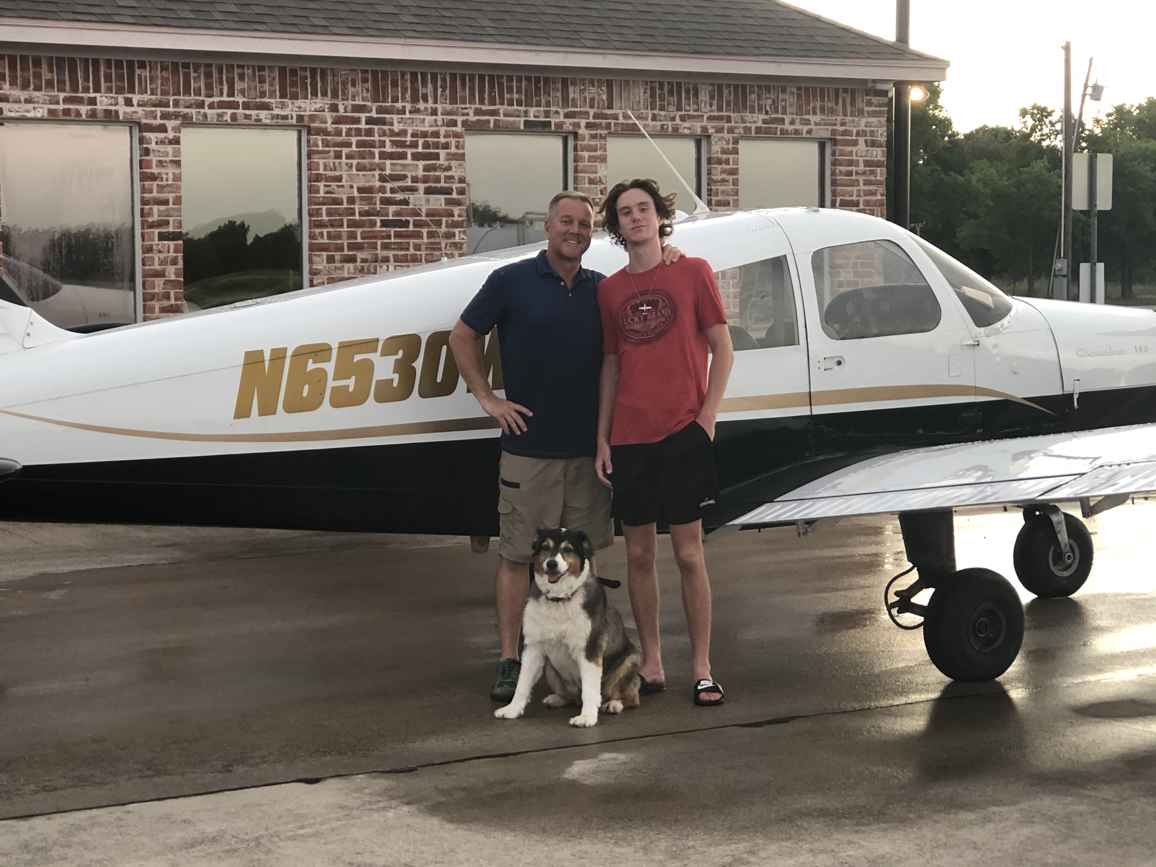 Cherokee before the crash with people beside it