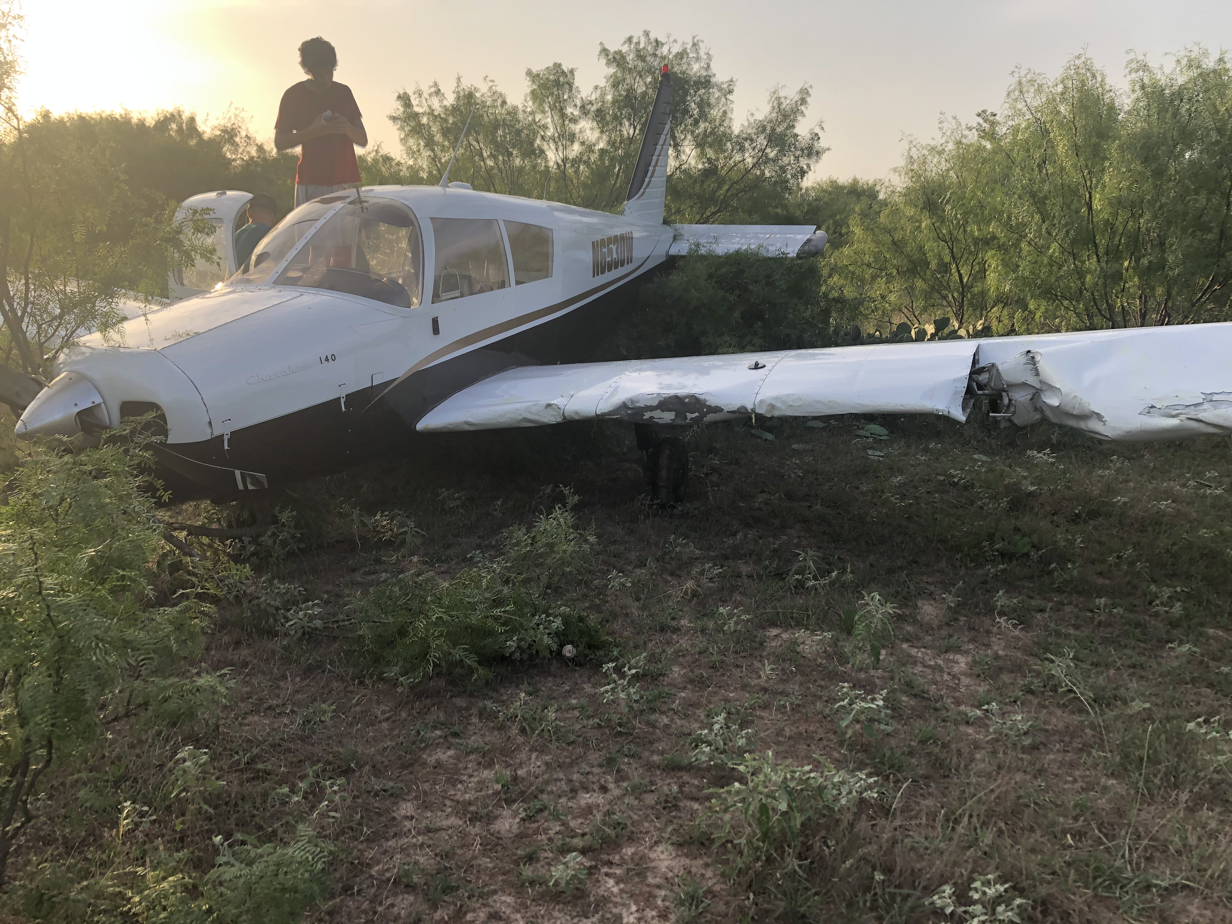 Aircraft lodged in brush after the forced landing